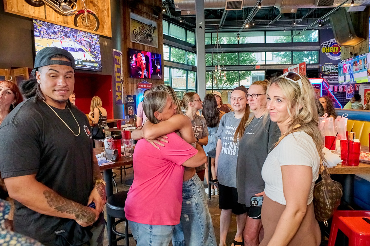 Fans smiling at the watch party