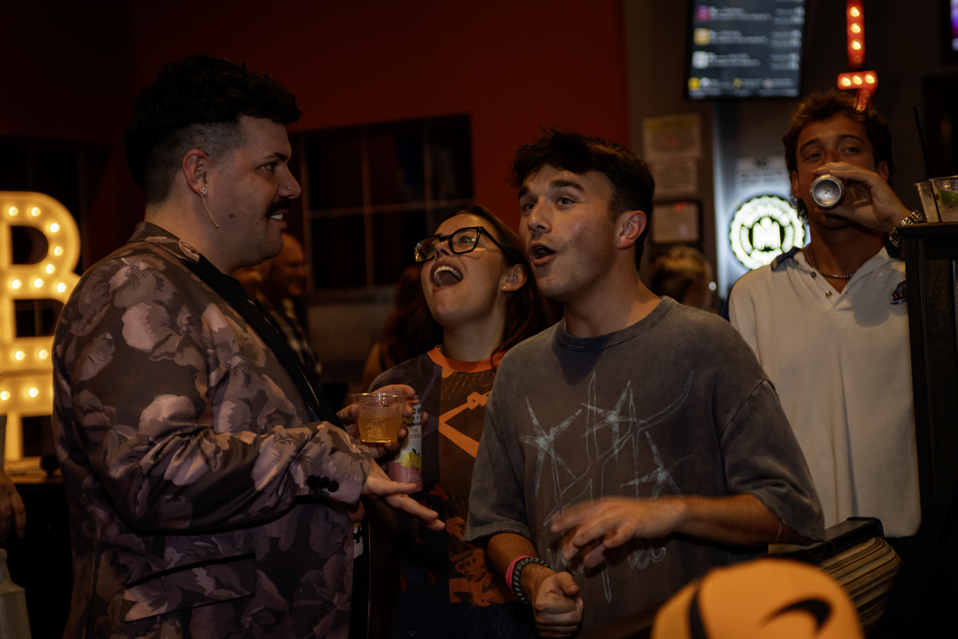 Fans smiling at the Nashville watch party